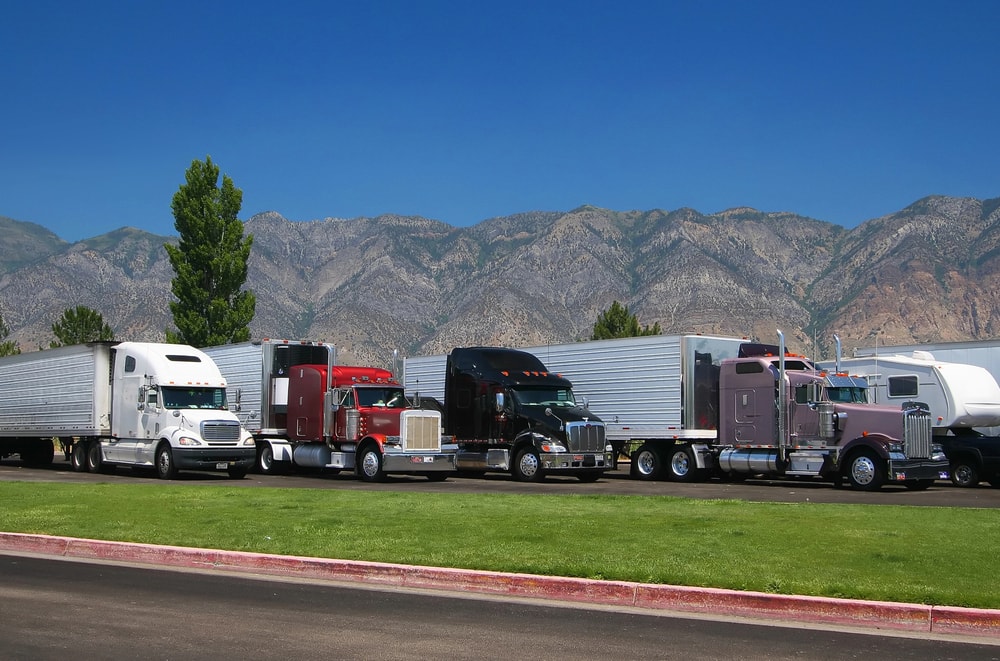 Trucks with dry vans parked in a row